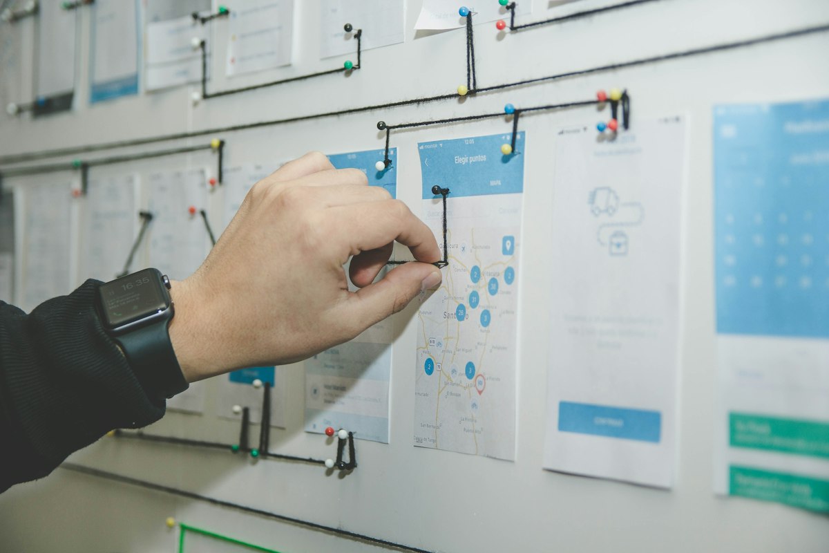 Two engineers mapping an engagement scope on a whiteboard